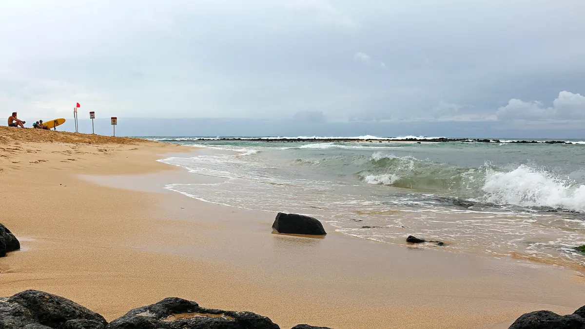 The sand and surf at Poipu Beach